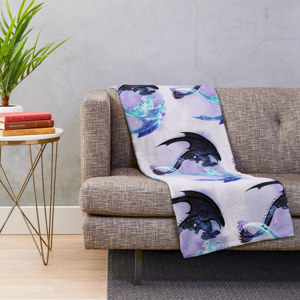 Toothless and Light Fury plush blanket featuring a cosmic, starry design