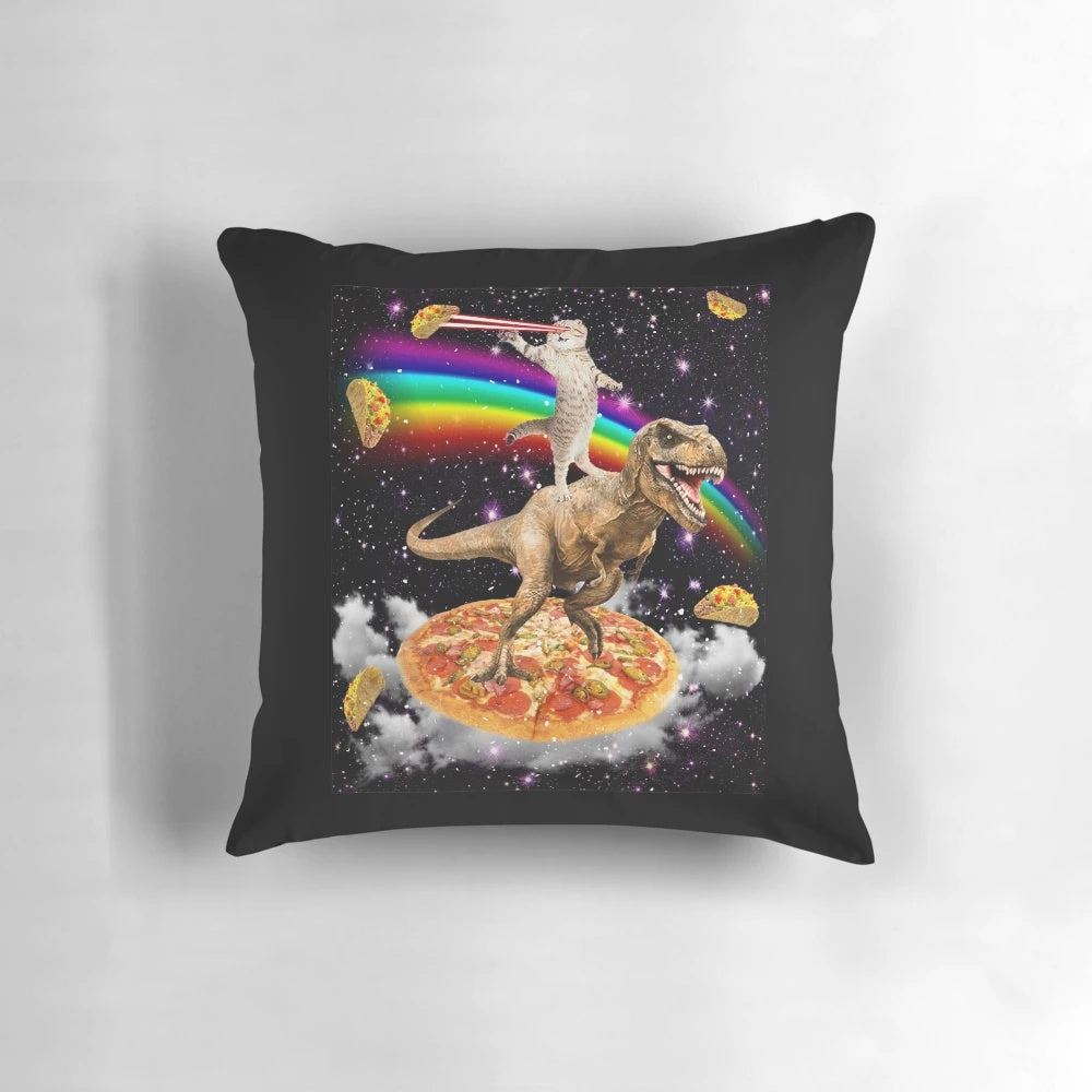 A colorful pillow featuring a galaxy-themed cat on a dinosaur on a pizza, with a rainbow and cosmic elements.