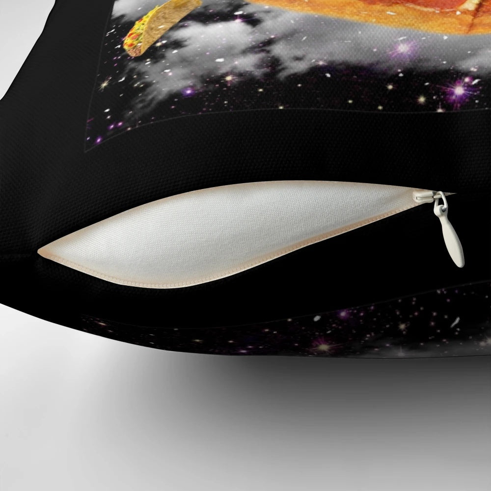 A colorful pillow featuring a galaxy-themed cat on a dinosaur on a pizza, with a rainbow and cosmic elements.