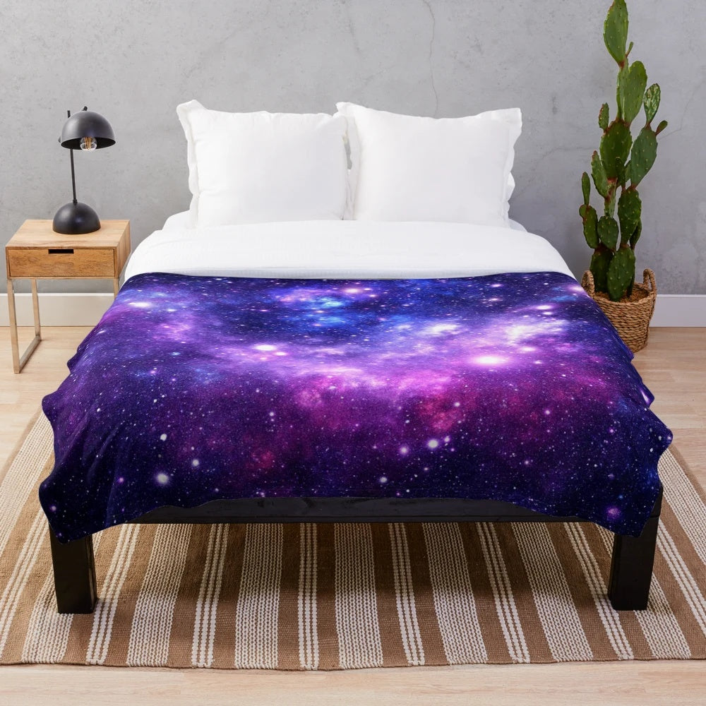 Purple and blue galaxy nebula plush blanket with shimmering stars