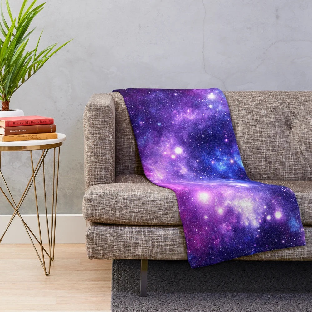 Purple and blue galaxy nebula plush blanket with shimmering stars