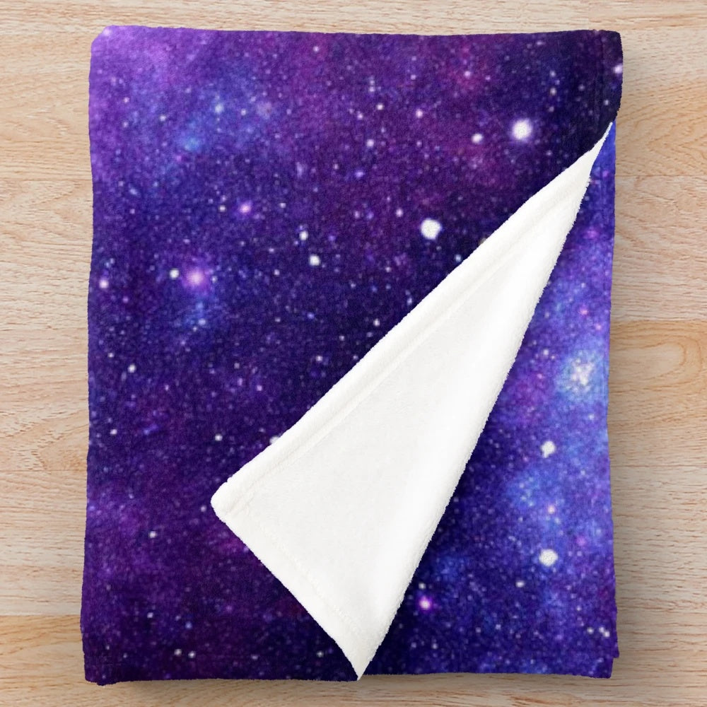 Purple and blue galaxy nebula plush blanket with shimmering stars