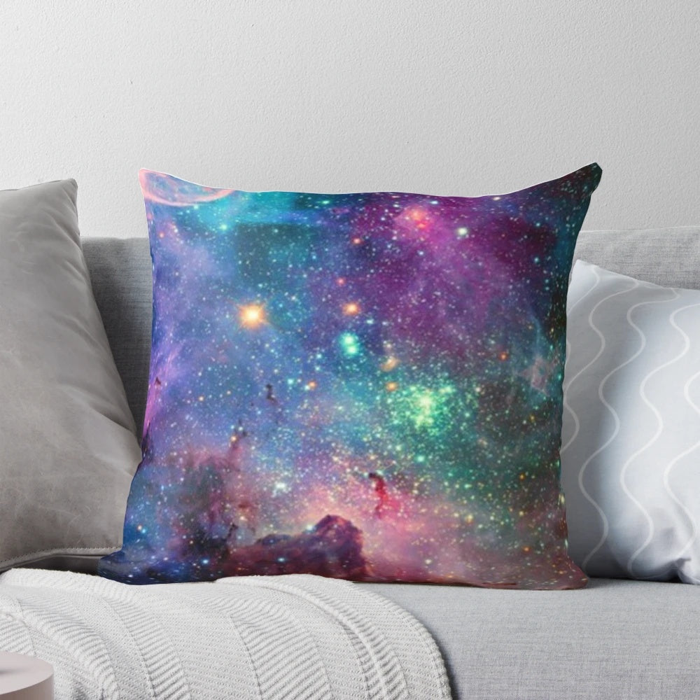 Galaxy-printed pillow with stars, planets, and cosmic elements