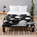 Plush blanket featuring a galaxy design