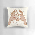 Cosmic-themed pillow with a hand-drawn design of hands forming a love symbol against a starry, galaxy-inspired background.