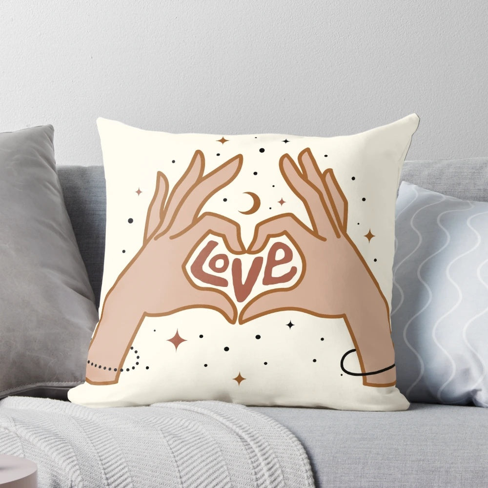 Cosmic-themed pillow with a hand-drawn design of hands forming a love symbol against a starry, galaxy-inspired background.