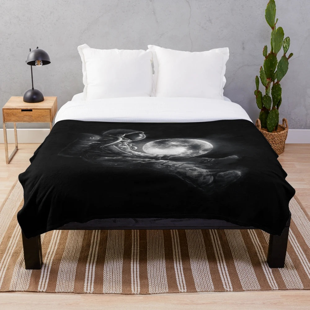 Plush blanket with cosmic moon and space design