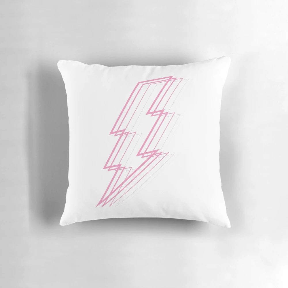 Pink lightning bolt design on a fluffy white pillow, symbolizing cosmic radiance.
