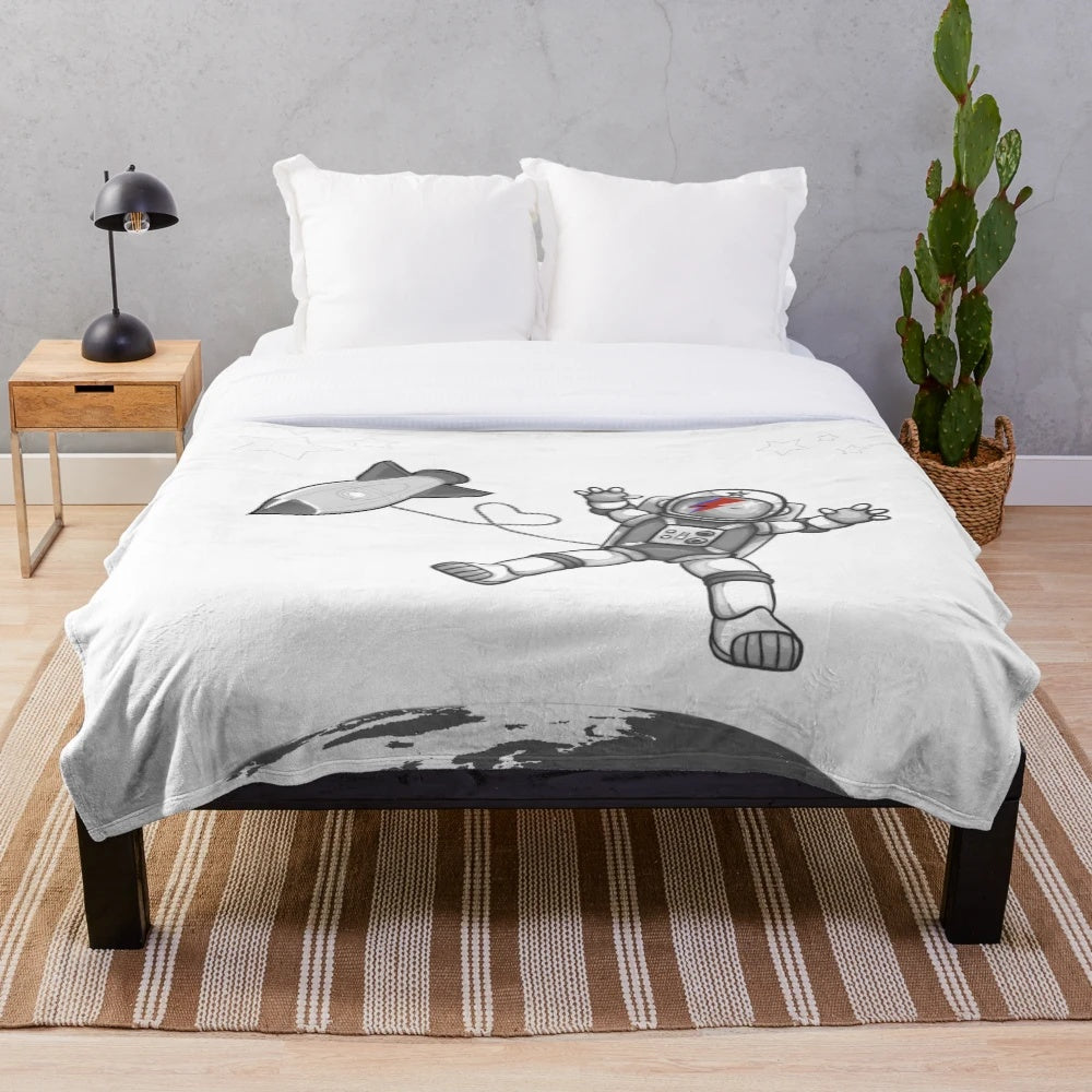 Plush blanket featuring a cosmic space design inspired by the music of David Bowie