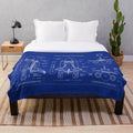 Plush blanket featuring a blueprint-style design of a NASA space shuttle
