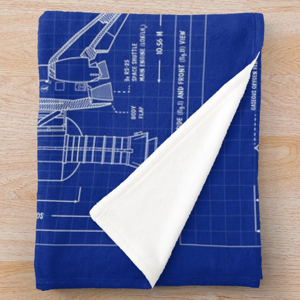 Plush blanket featuring a blueprint-style design of a NASA space shuttle