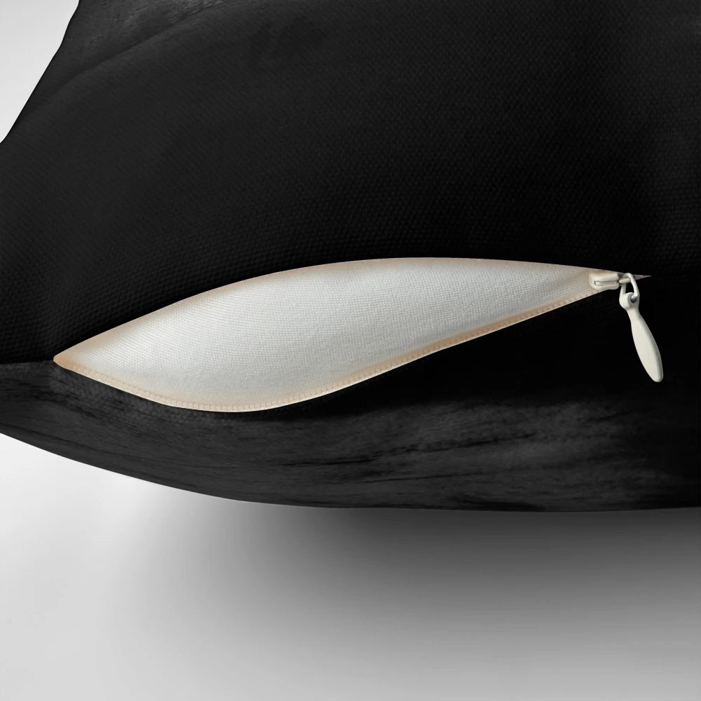 Monochrome abstract landscape pillow with moon, stars, and spaceman floating in orbit