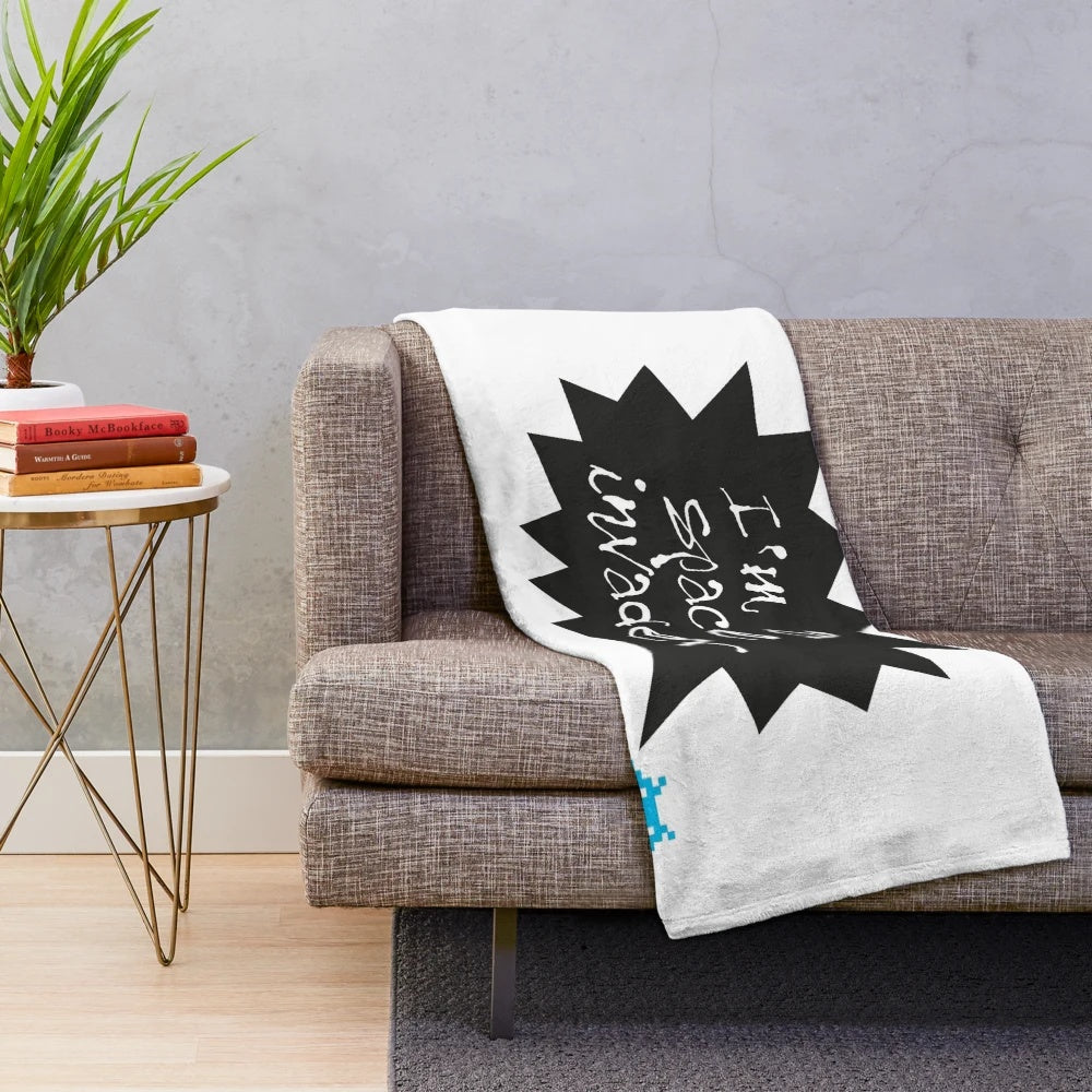Plush blanket depicting a space invader design, perfect for music fans