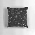 A decorative space-themed pillow with a vibrant cosmic design, featuring planets, stars, and galaxies.