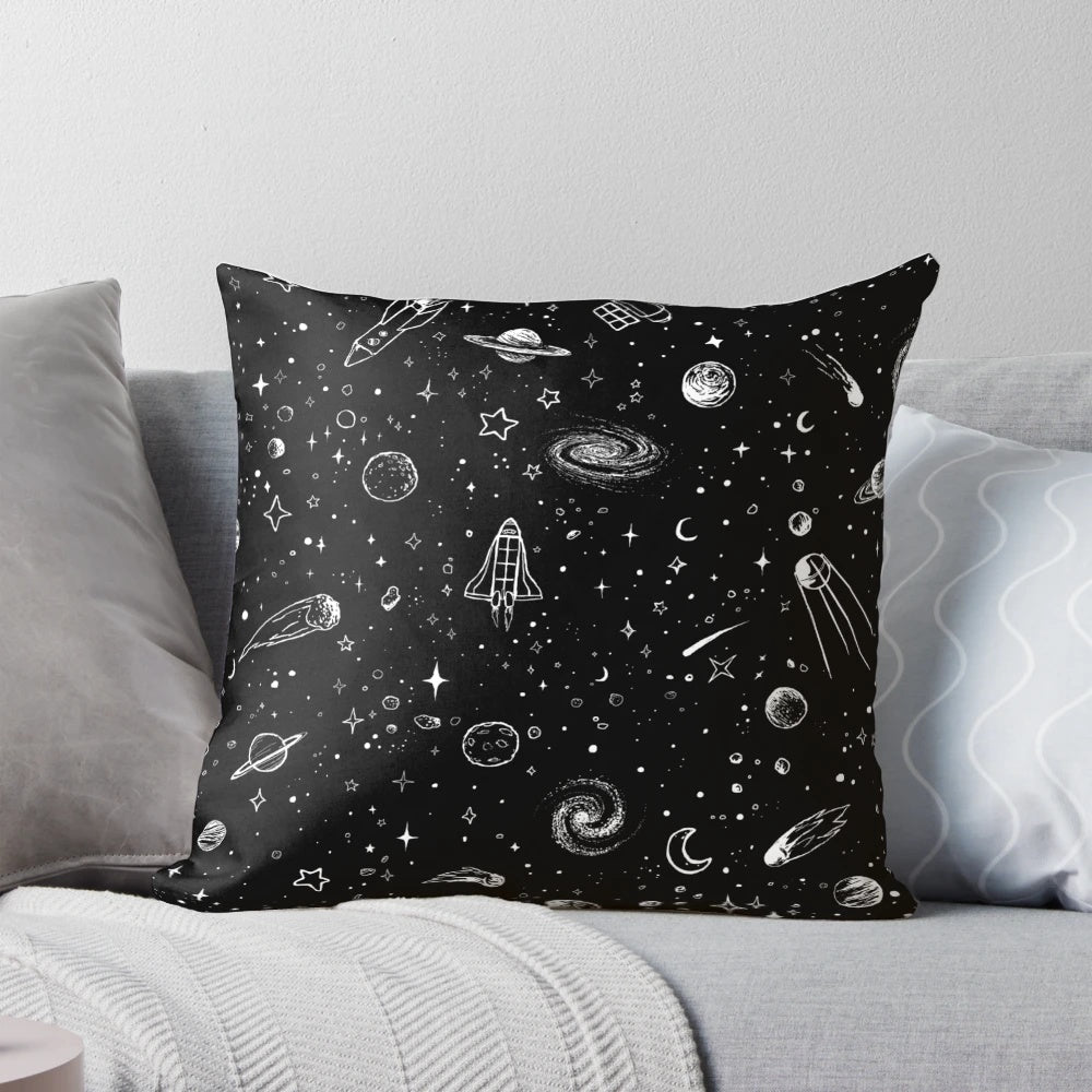 A decorative space-themed pillow with a vibrant cosmic design, featuring planets, stars, and galaxies.