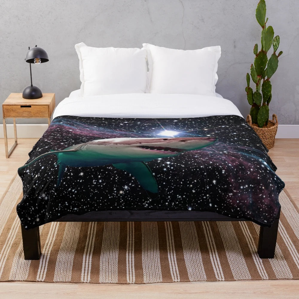 Plush blanket featuring a space shark with glowing teeth and stars in the background