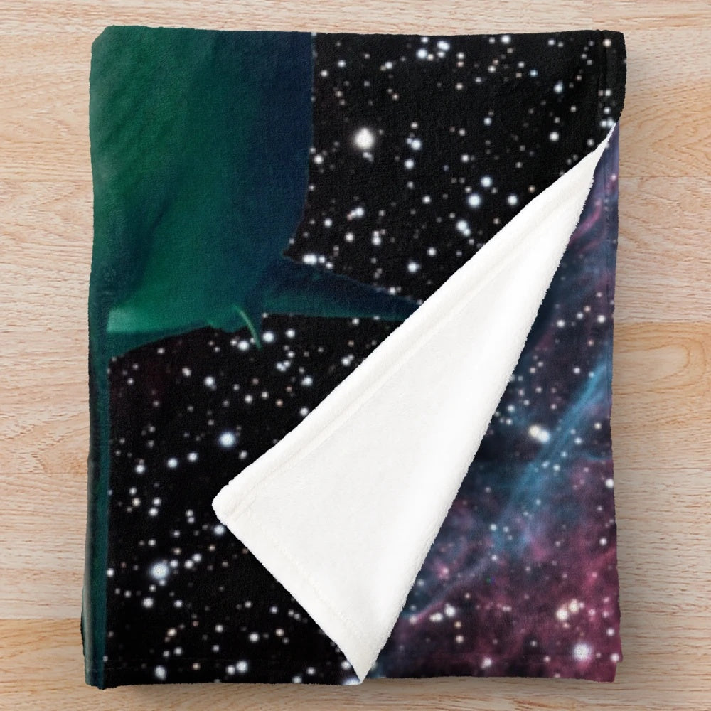 Plush blanket featuring a space shark with glowing teeth and stars in the background