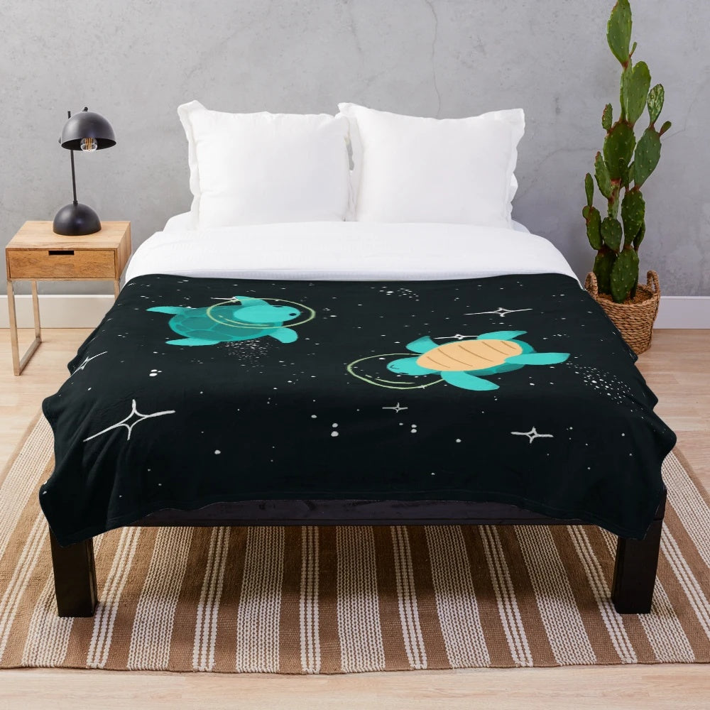 Cozy plush blanket featuring adorable space turtles floating among the stars
