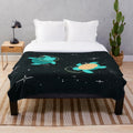 Cozy plush blanket featuring adorable space turtles floating among the stars