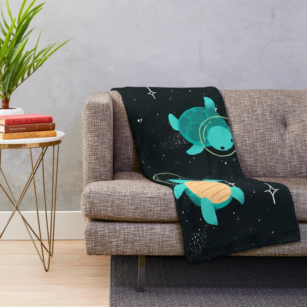 Cozy plush blanket featuring adorable space turtles floating among the stars