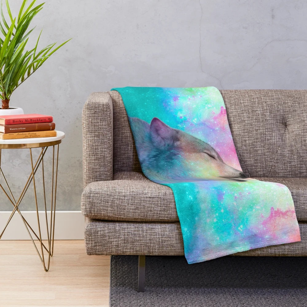 Plush blanket with cosmic wolf design in surreal dreamscape
