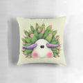 Vibrant green and pink nudibranch, also known as the leaf sheep sea slug, on a soft pillow