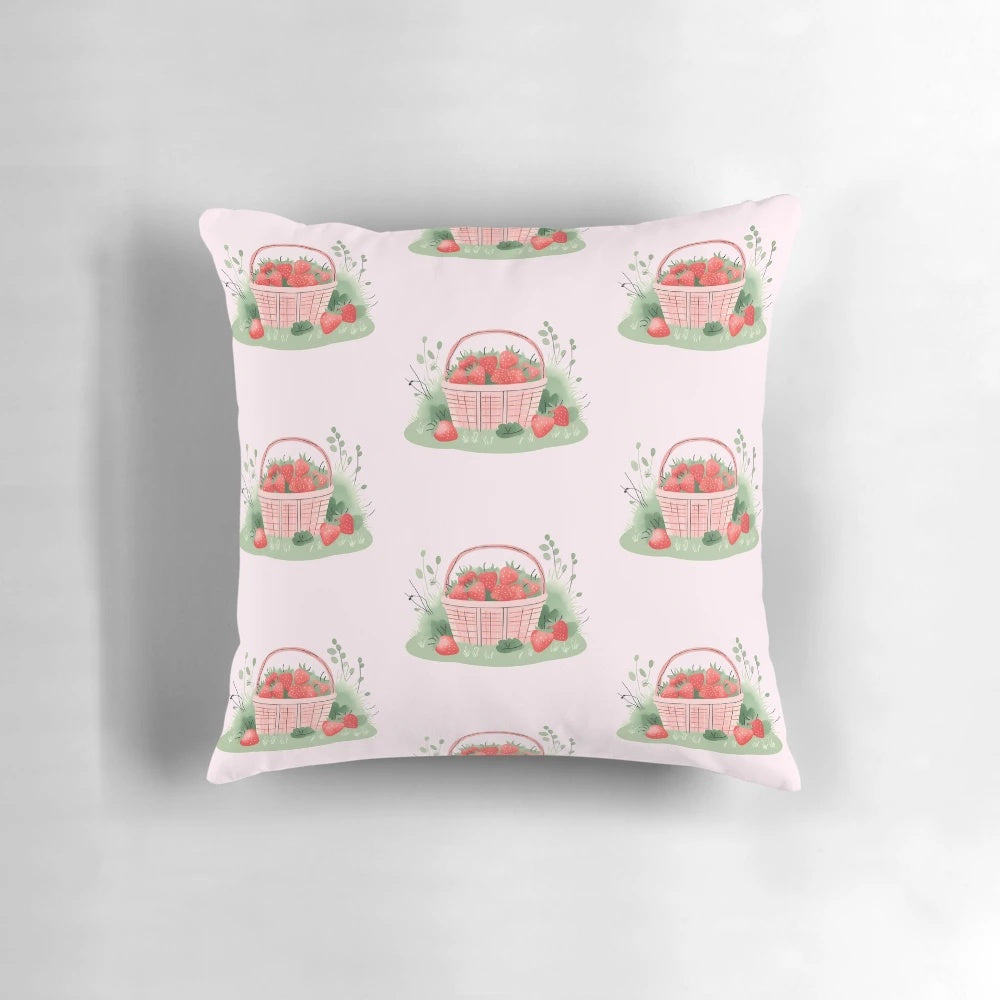 A soft, plush pillow featuring a vibrant strawberry pattern in a picnic basket design, perfect for a cozy, cottagecore-inspired space.