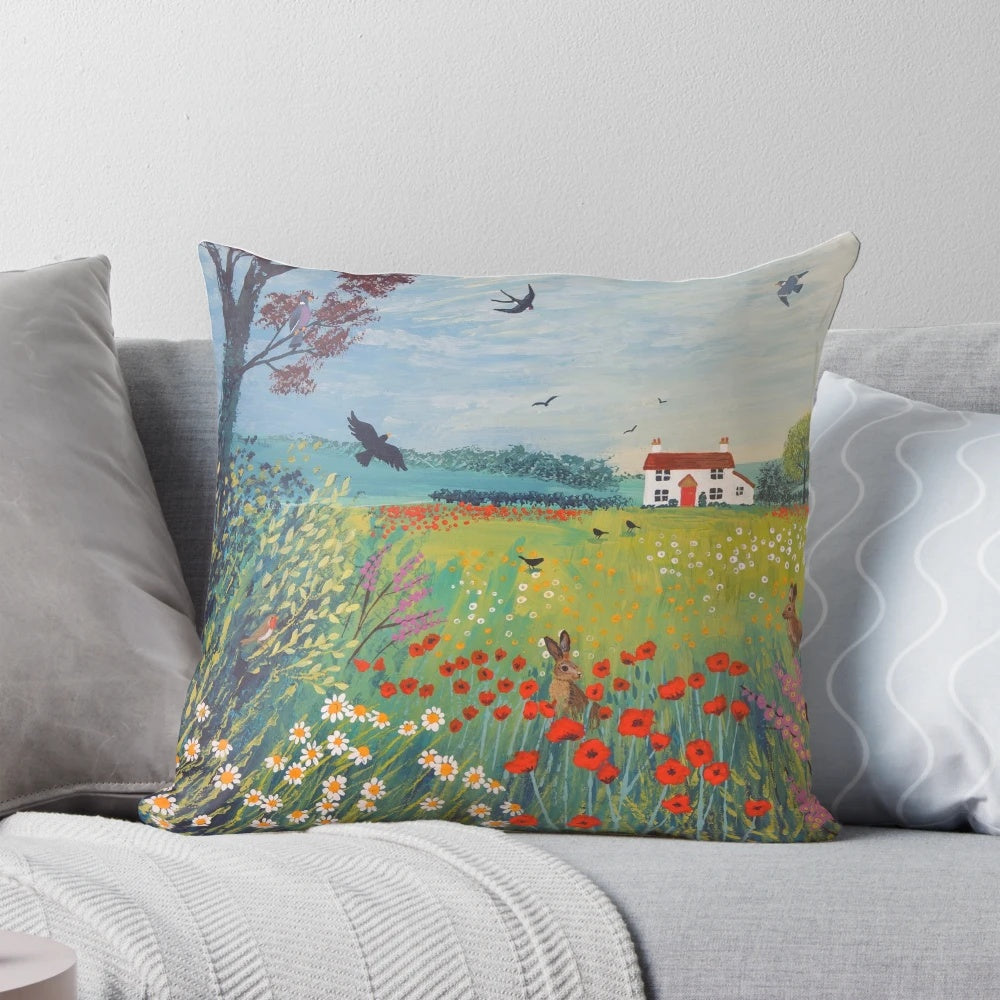 Pillow featuring a beautiful English countryside landscape with meadows, cottages, hares, and birds