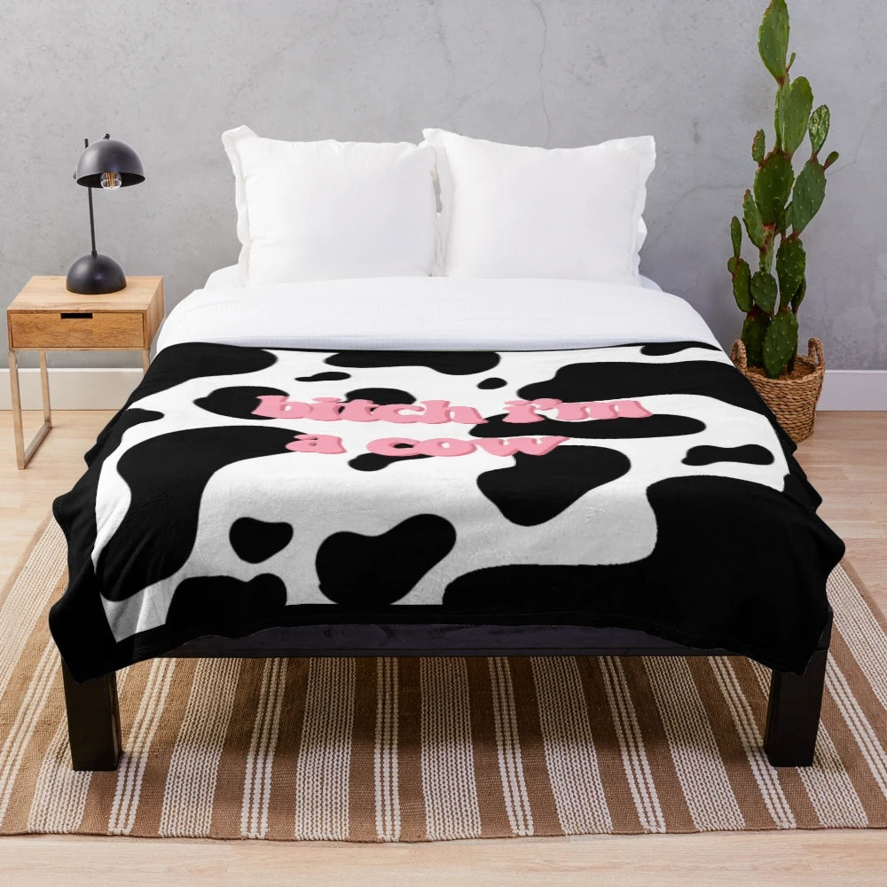 Cozy cow print plush blanket