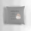 Cowboy-themed decorative pillow with a religious parody design