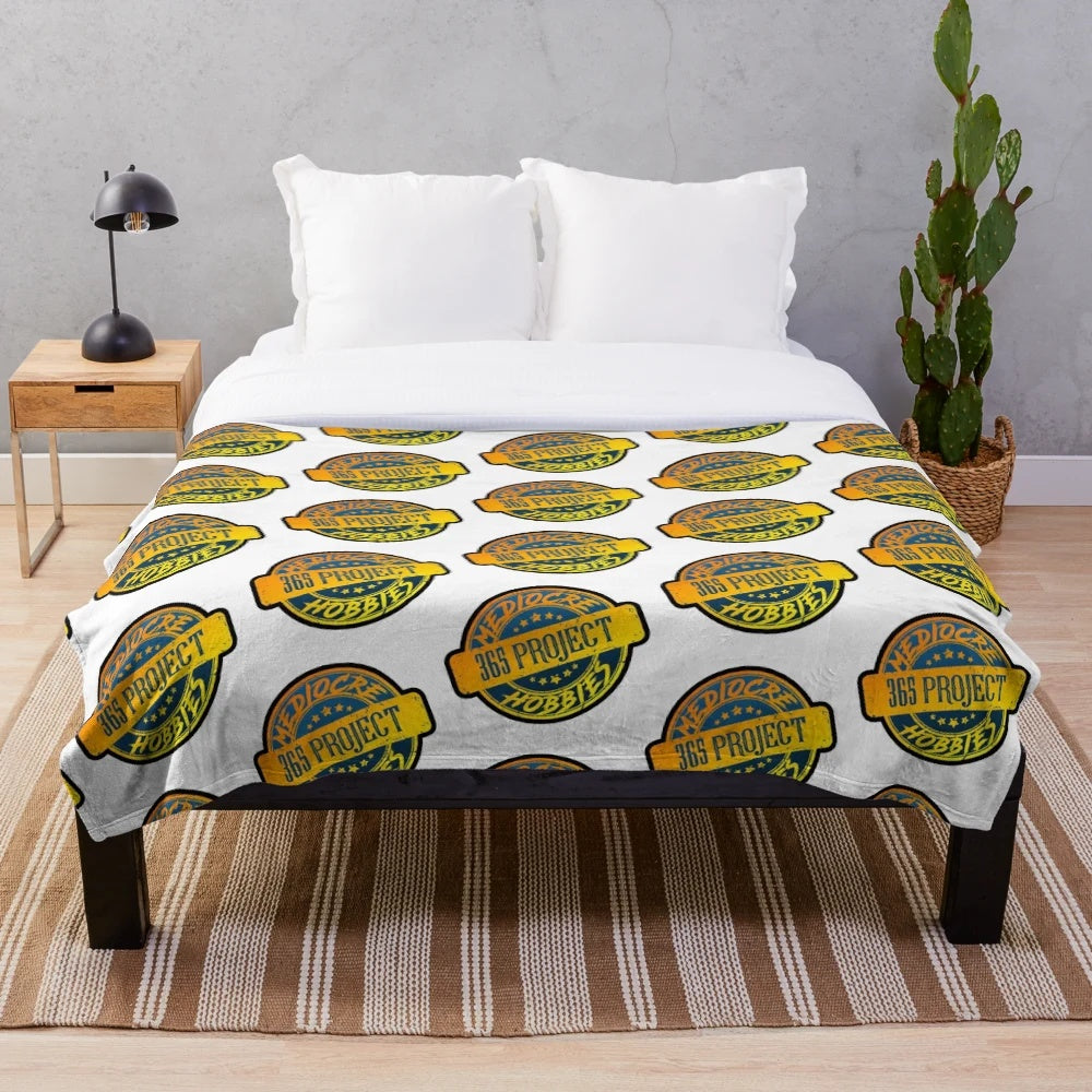 Plush blanket featuring the Mediocre Hobbies YouTube channel branding