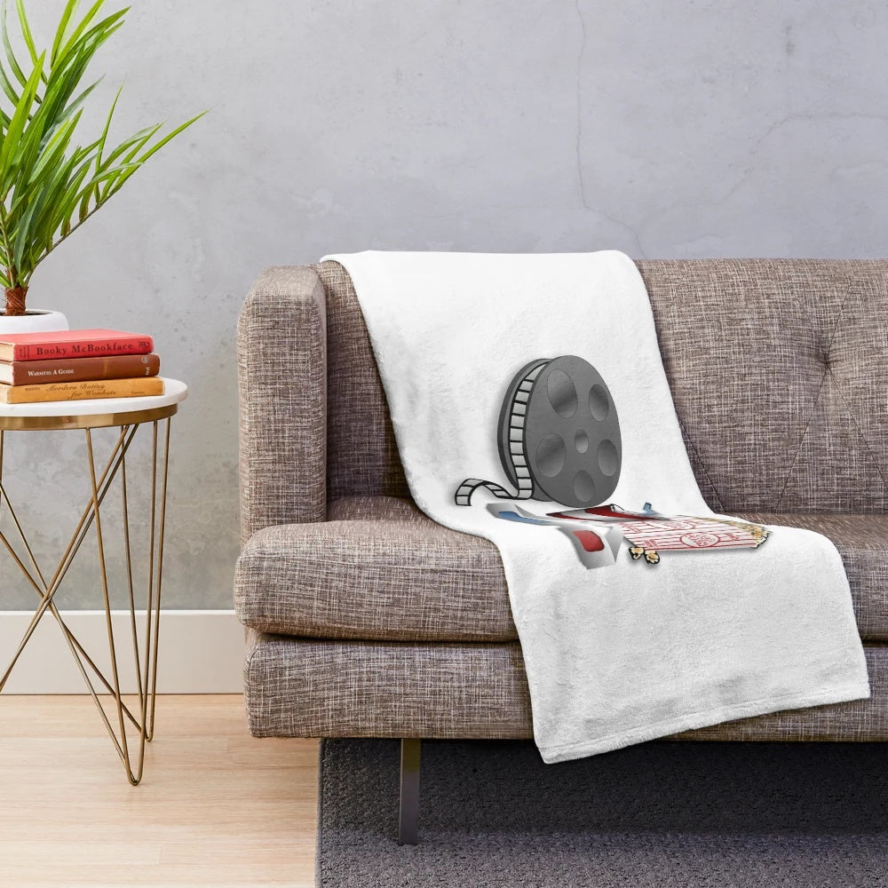 3D cinema plush blanket featuring movie reel and popcorn design