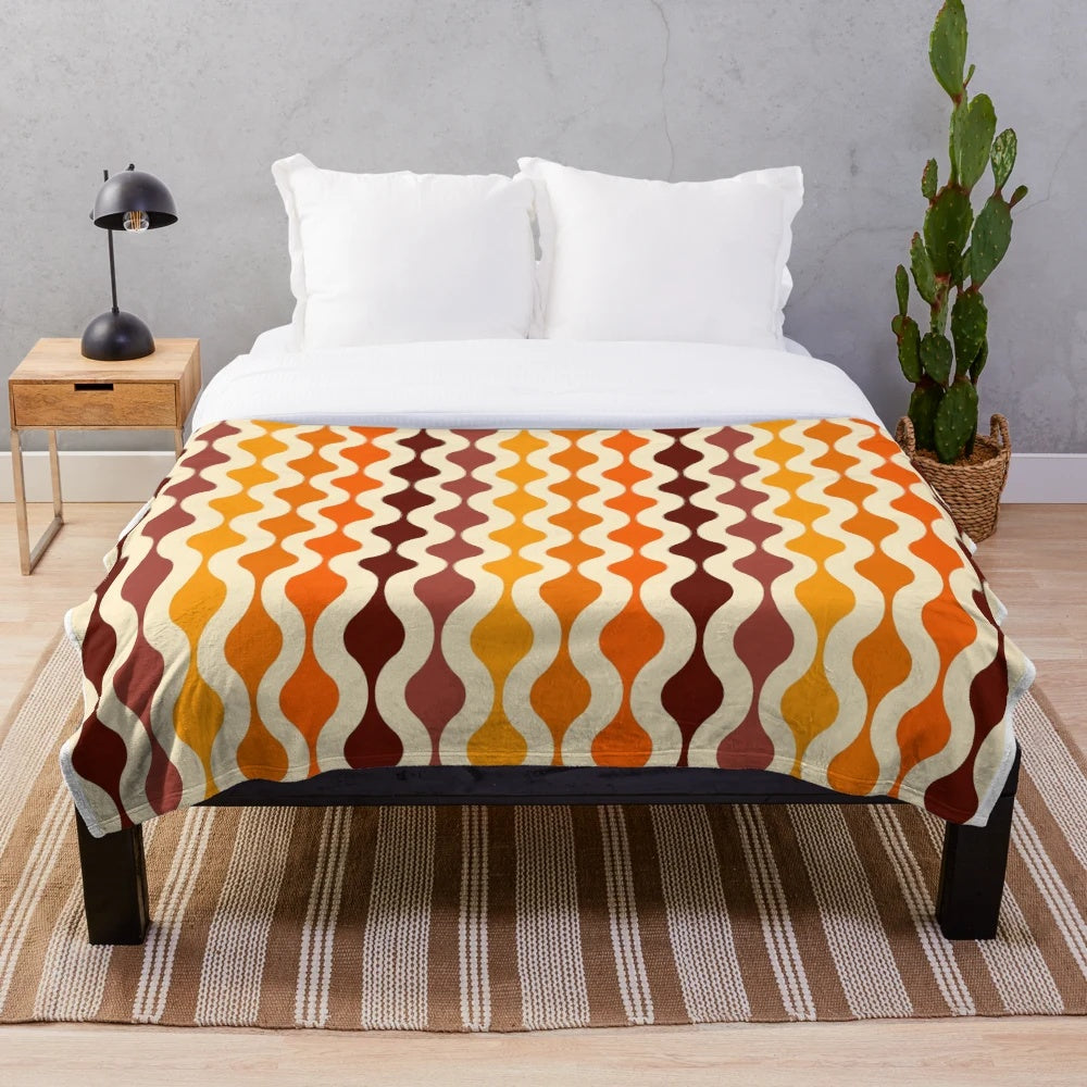 Soft and plush blanket with a vibrant 70s inspired groovy pattern