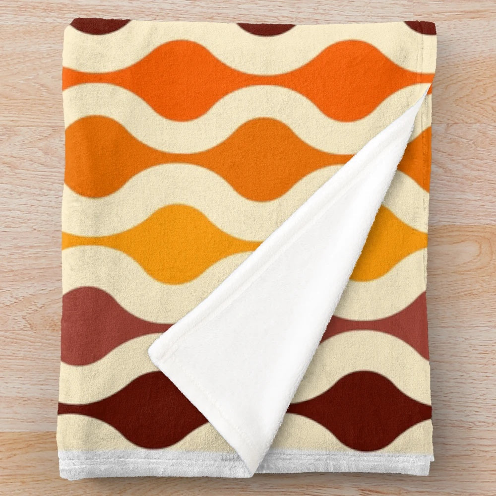 Soft and plush blanket with a vibrant 70s inspired groovy pattern