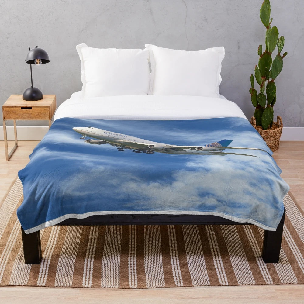United Airlines 747 plush blanket with airplane and travel-inspired design