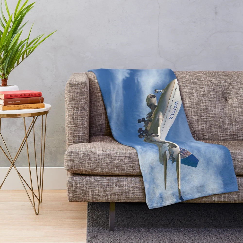 United Airlines 747 plush blanket with airplane and travel-inspired design