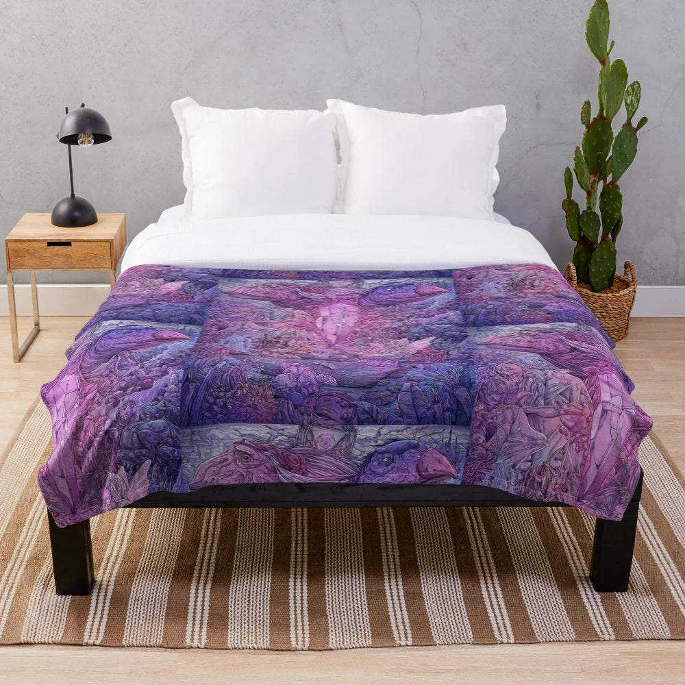 A cozy plush blanket featuring characters and imagery from the 80s fantasy film The Dark Crystal.
