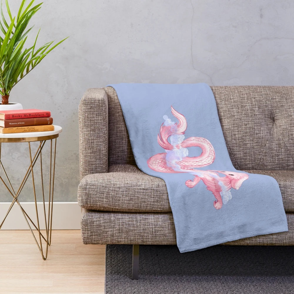Cozy 80s-inspired plush blanket featuring a fantasy creature design