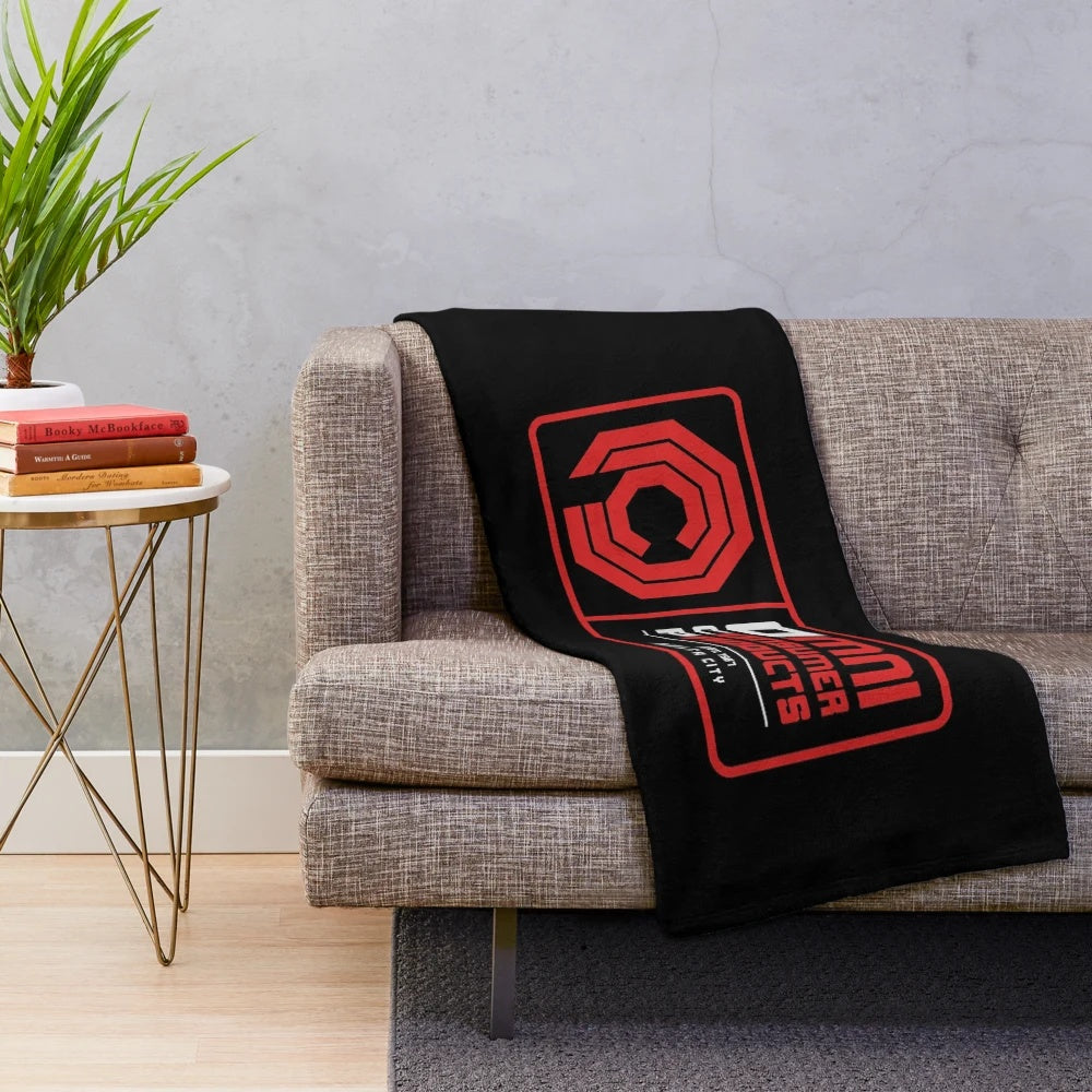 Cozy plush blanket with OCP inspired design for 80s movie lovers