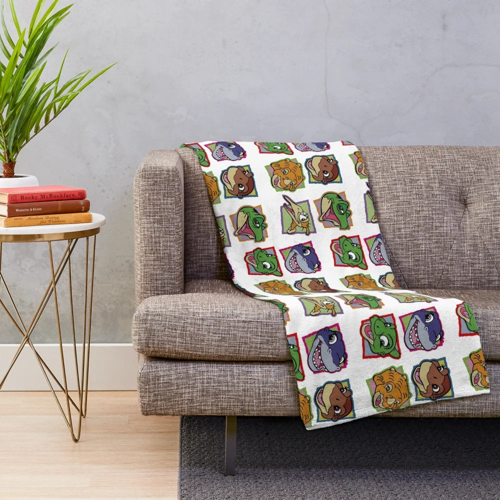 A plush blanket featuring characters from the classic 90s movie The Land Before Time