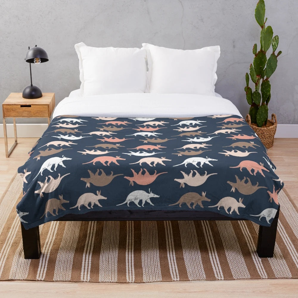 Aardvark plush blanket in navy blue color for a cozy and wildlife-inspired living space