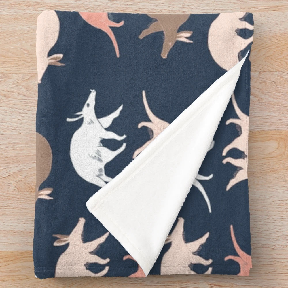 Aardvark plush blanket in navy blue color for a cozy and wildlife-inspired living space