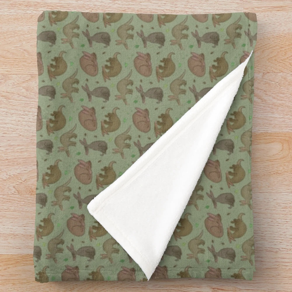 Aardvark plush blanket with a green leaf pattern