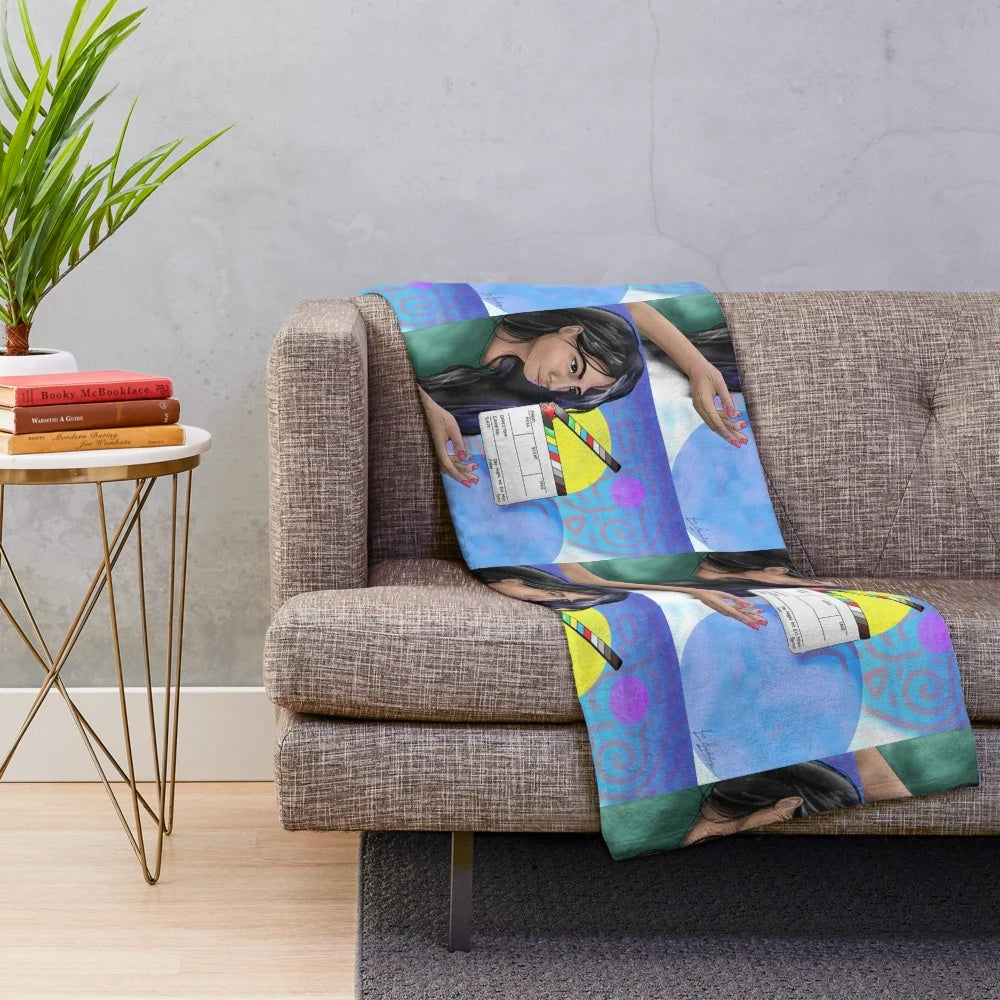 Action cinema themed plush blanket with movie clapperboard and other film elements