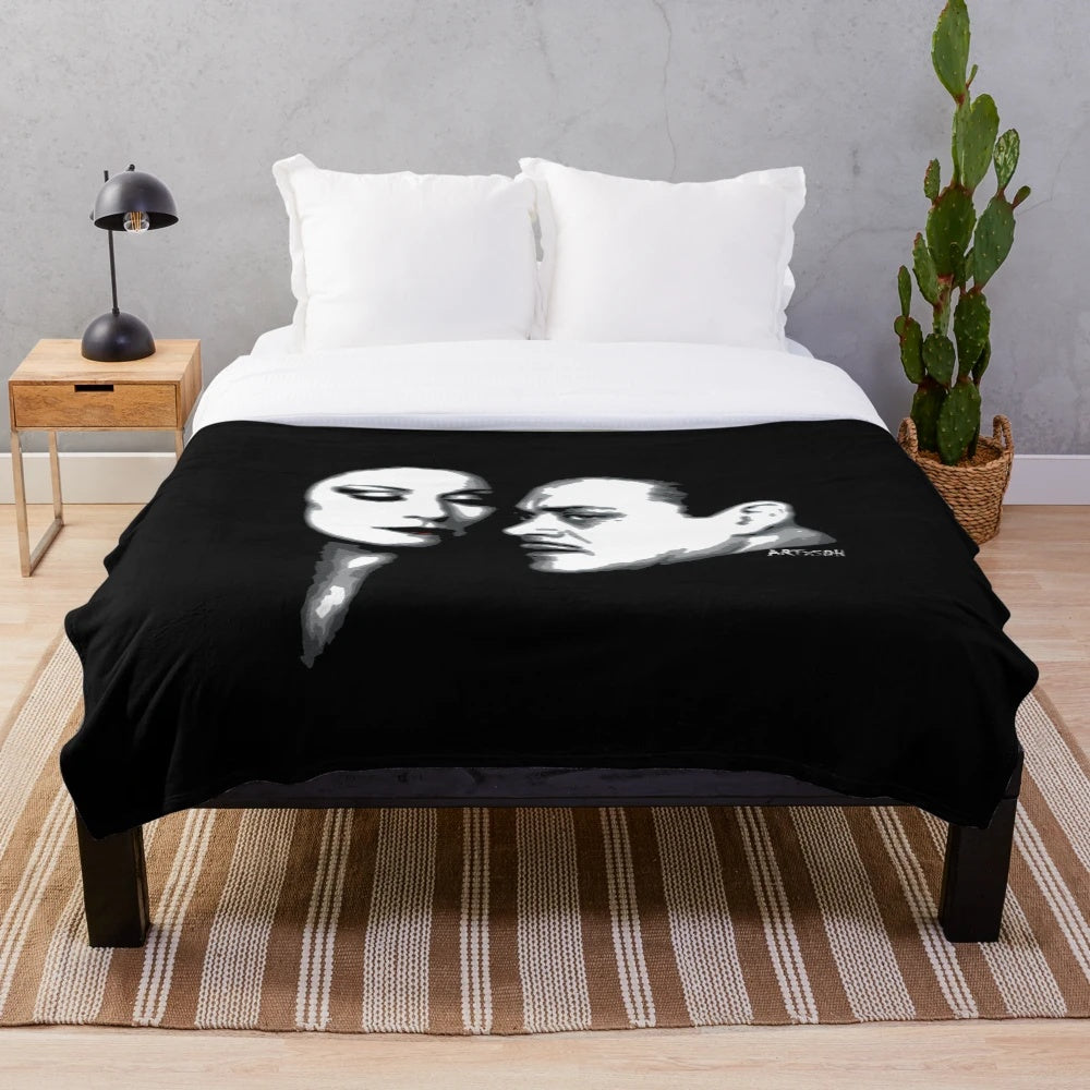 Addams Family-inspired plush blanket featuring Gomez and Morticia