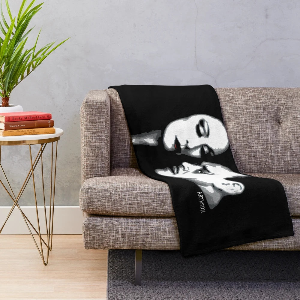 Addams Family-inspired plush blanket featuring Gomez and Morticia
