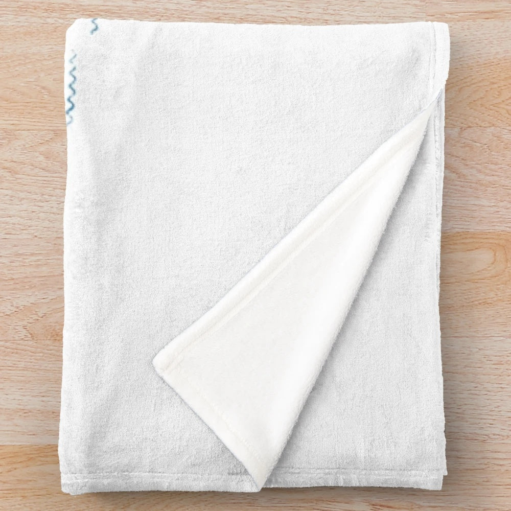 Soft and snuggly plush blanket featuring cute doodles of a seal, whale, and other marine life