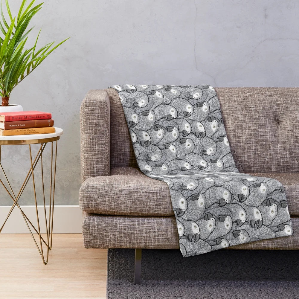 Soft and cuddly plush blanket featuring an African Grey Parrot