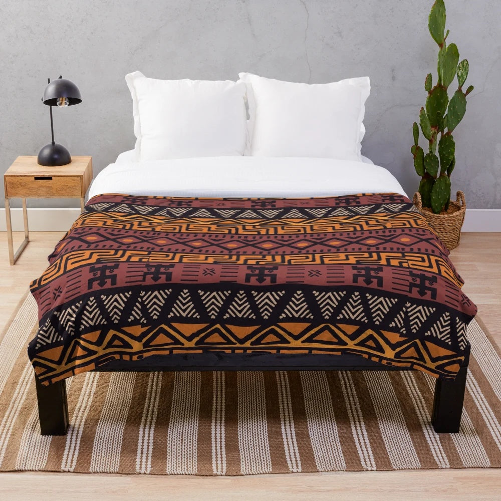 Plush blanket with an earthy, tribal African mudcloth pattern in warm, natural tones