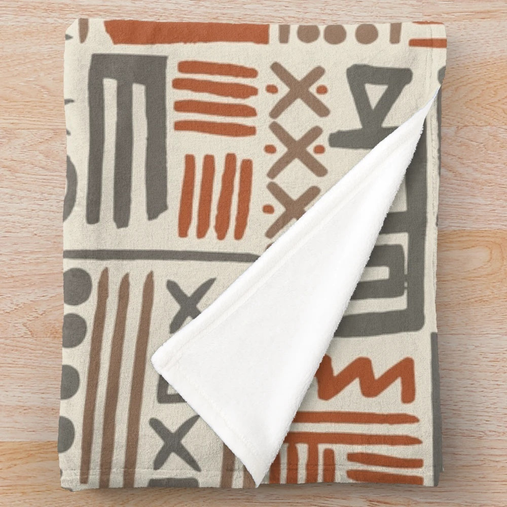 African-inspired plush blanket with traditional mudcloth pattern